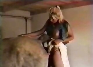 Blonde in white skirt teases the animal with upskirt action at first