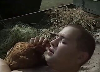 Outdoor bestiality scene with a chicken that fucks a married couple