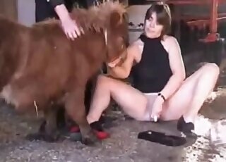 Pale-skinned hottie fucks herself with a dildo to seduce a pony