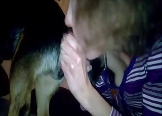 Clothed amateur woman filmed throating the dog dick like crazy