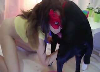 Black dog enjoys a nice handjob from a playful bottomless slag