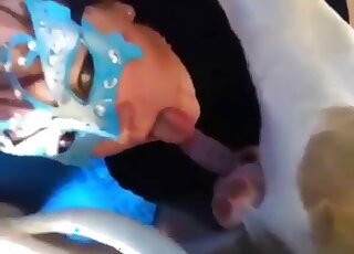 Attractive lady in a blue mask is happy to appreciate brutal oral