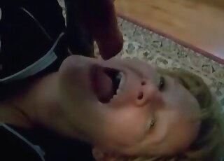 Cum-thirsty MILF deepthroats her dog’s dick and gets mouth creamed
