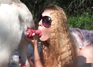 MILF with glasses sucks animal’s pink cock and can’t get enough of it
