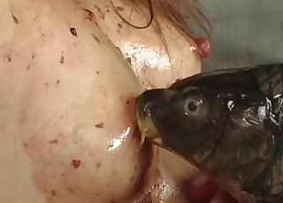 JAV bestiality featuring a captured girl that fucks that dead fish
